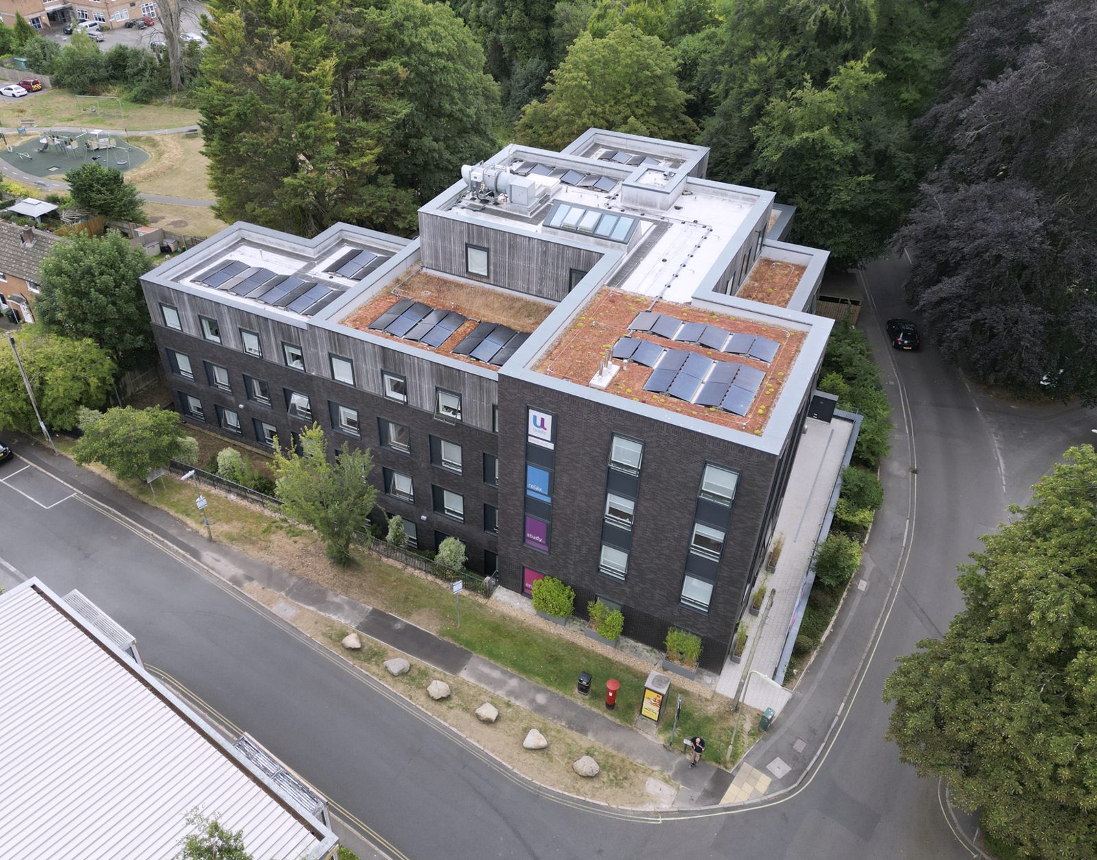 Aerial view of the completed Sparkford Road building in Winchester, set among mature trees.