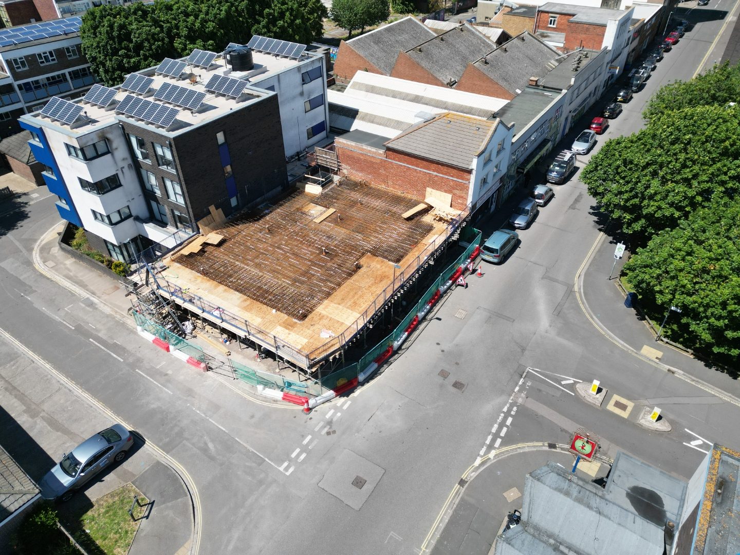 Aerial view of the site with reinforcement laid across the first floor deck.